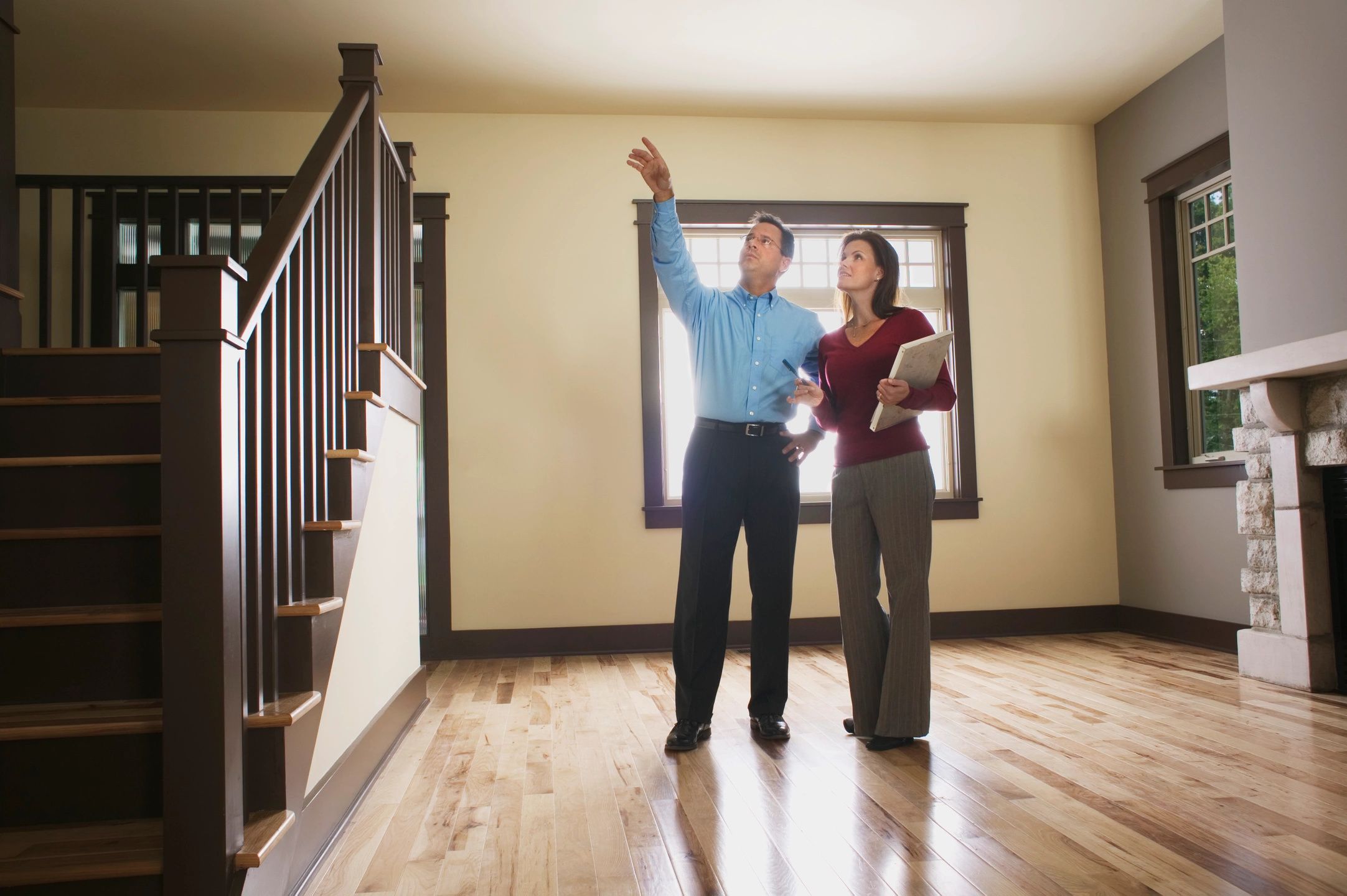 A man and woman standing in the middle of a room.